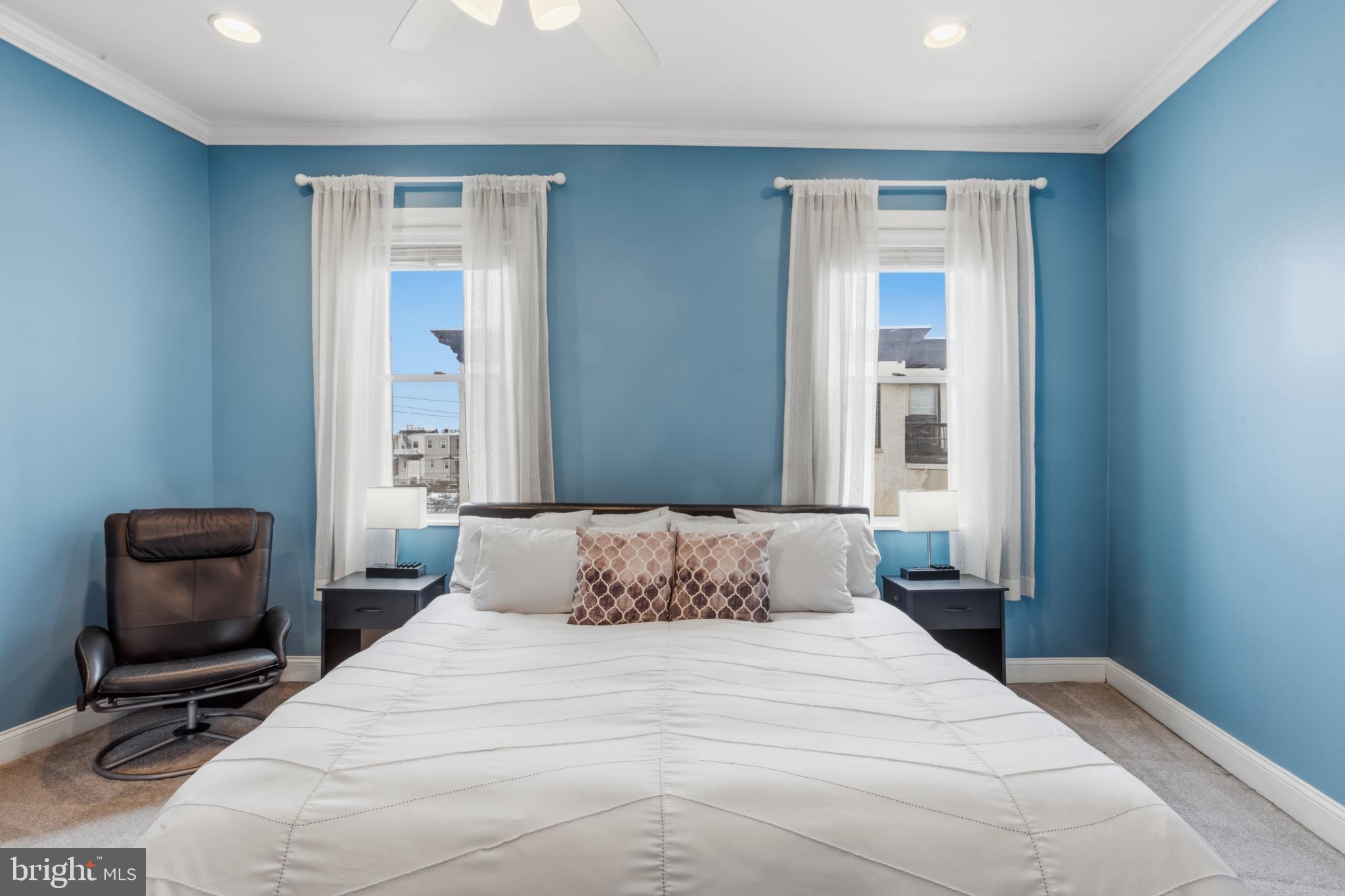 902 South 8th Street Philadelphia, PA 19147 - Photo 24 of 33 a bedroom with a bed and a chair