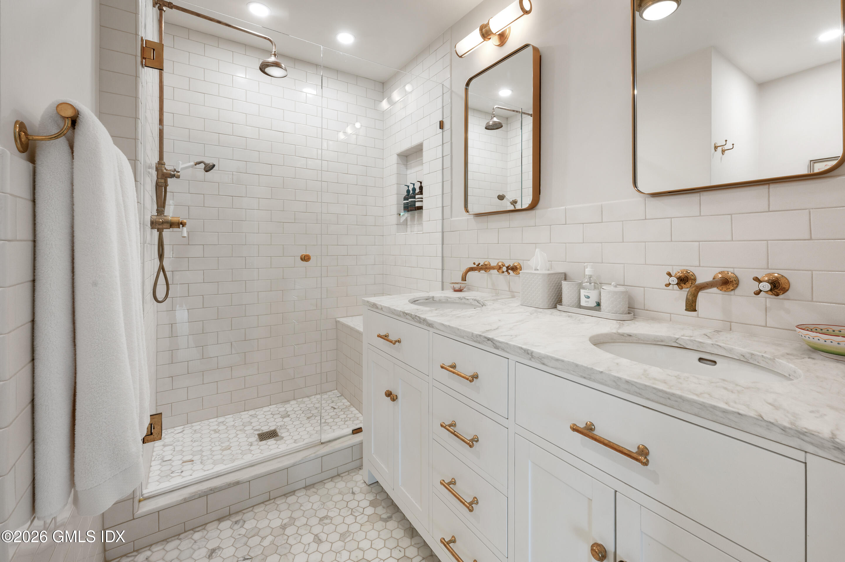 115 River Road, Unit 3 Cos Cob, CT 06807 - Photo 14 of 40 a bathroom with a shower sink and mirror