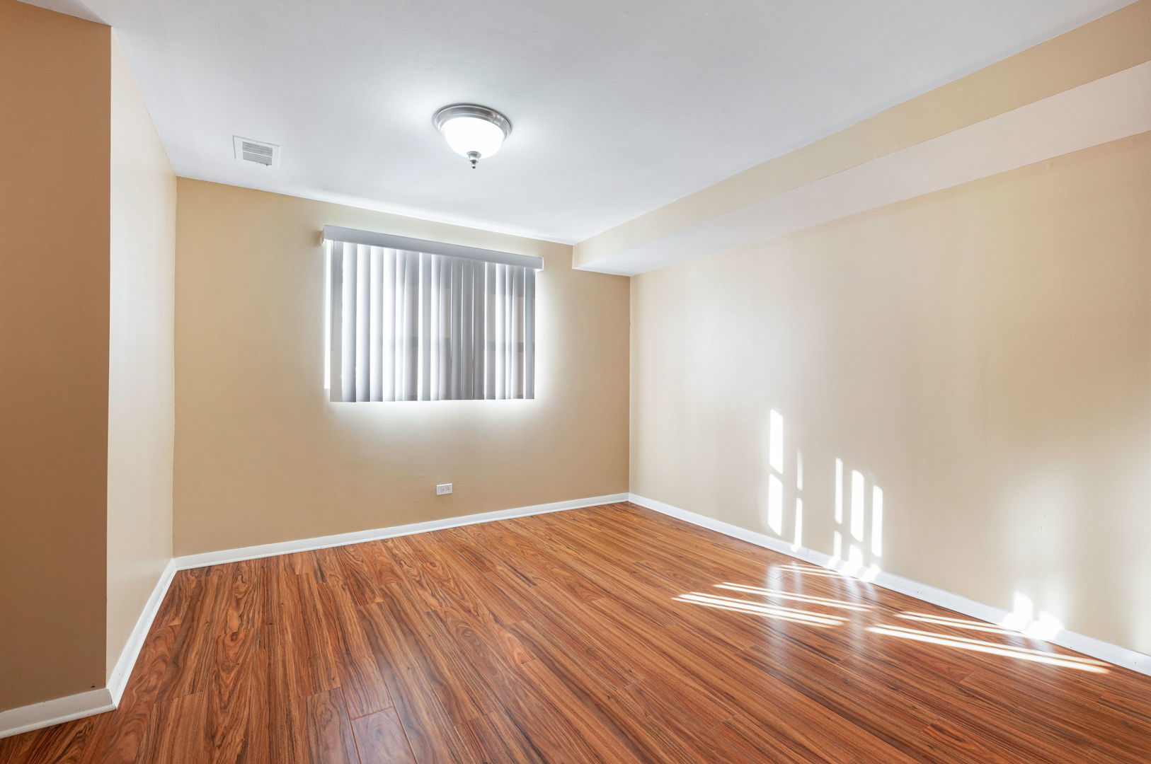 920 Valley Stream Drive Wheeling, IL 60090 - Photo 17 of 29 a view of empty room with wooden floor and fan