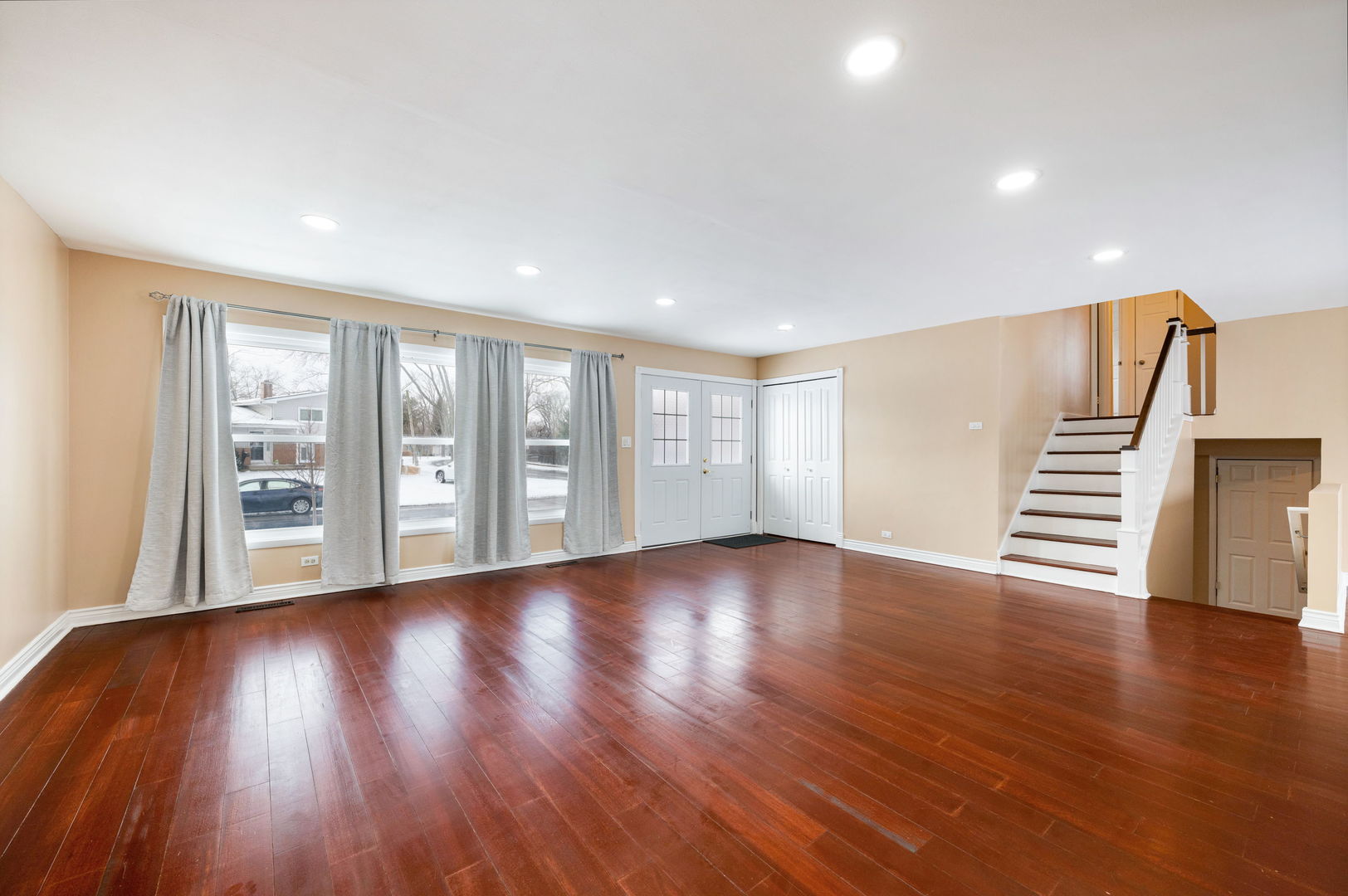 920 Valley Stream Drive Wheeling, IL 60090 - Photo 6 of 29 a view of an empty room with wooden floor and a window