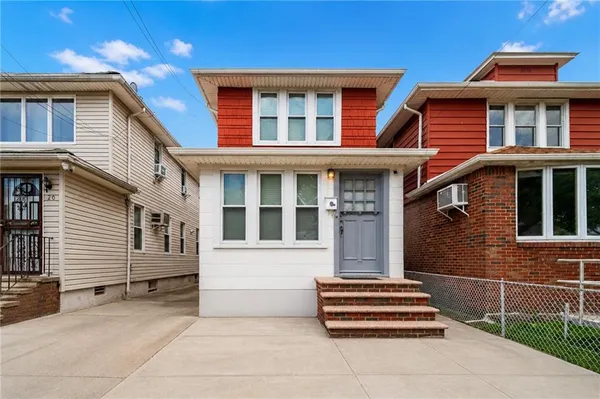 a front view of a house with a garage