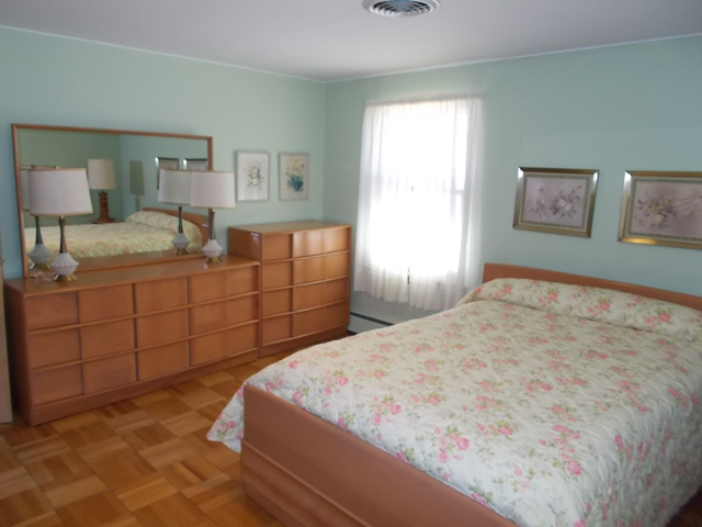 201 Maple Street Cedar Point, IL 61316 - Photo 7 of 12 a bedroom with a bed and a dresser