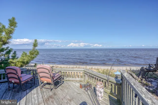 a view of a chairs and table on the wooden floor