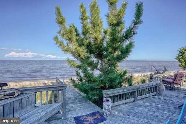 a view of a deck with furniture
