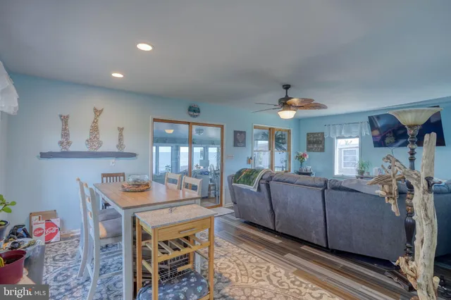 a view of a dining room with furniture and a window