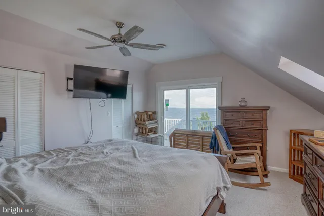 a spacious bedroom with a bed and window