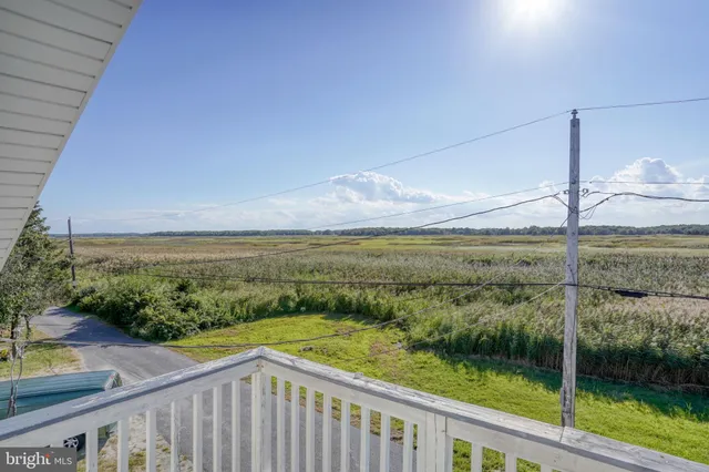 a view of a balcony with an ocean view