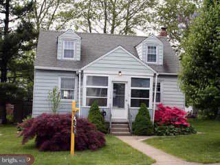 116 Roberts Road Aston, PA 19014 - Photo 1 of 1 a front view of a house with a garden and plants