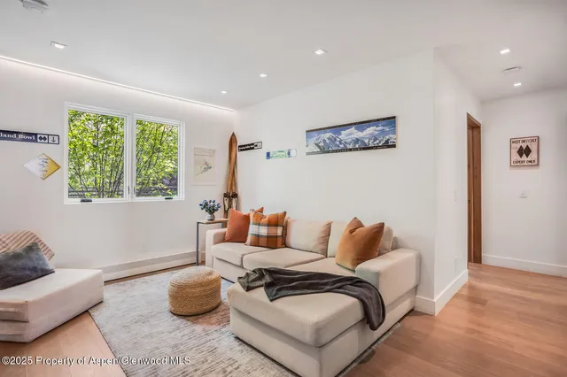 a living room with furniture and a window