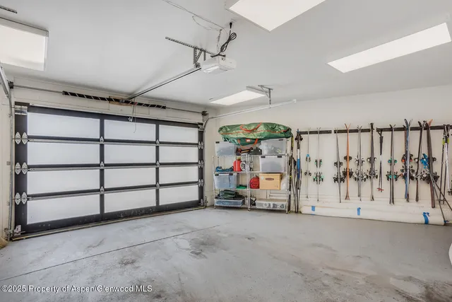 a balcony with table and chairs