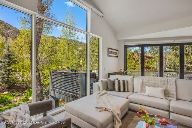 a bedroom with furniture and windows