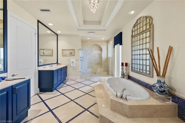 a spacious bathroom with a bathtub sink and shower