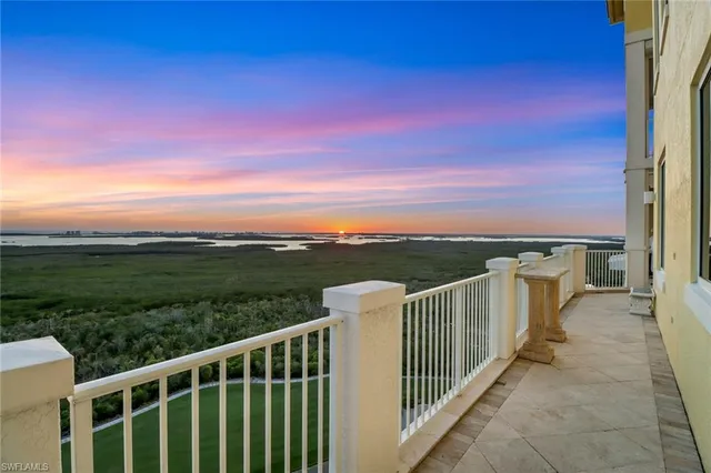 a view of a balcony with city