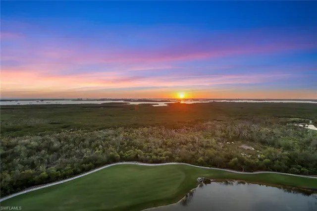 a view of a lake with a mountain in the background