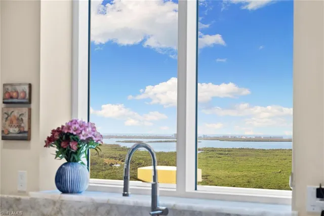 a view of living room with furniture and floor to ceiling window
