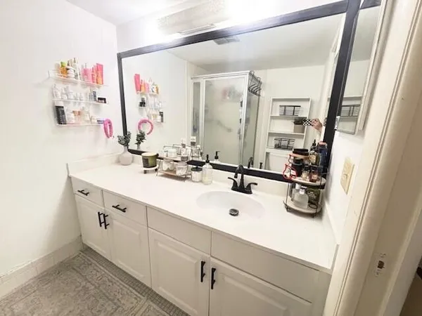 a bathroom with a double vanity sink mirror and double