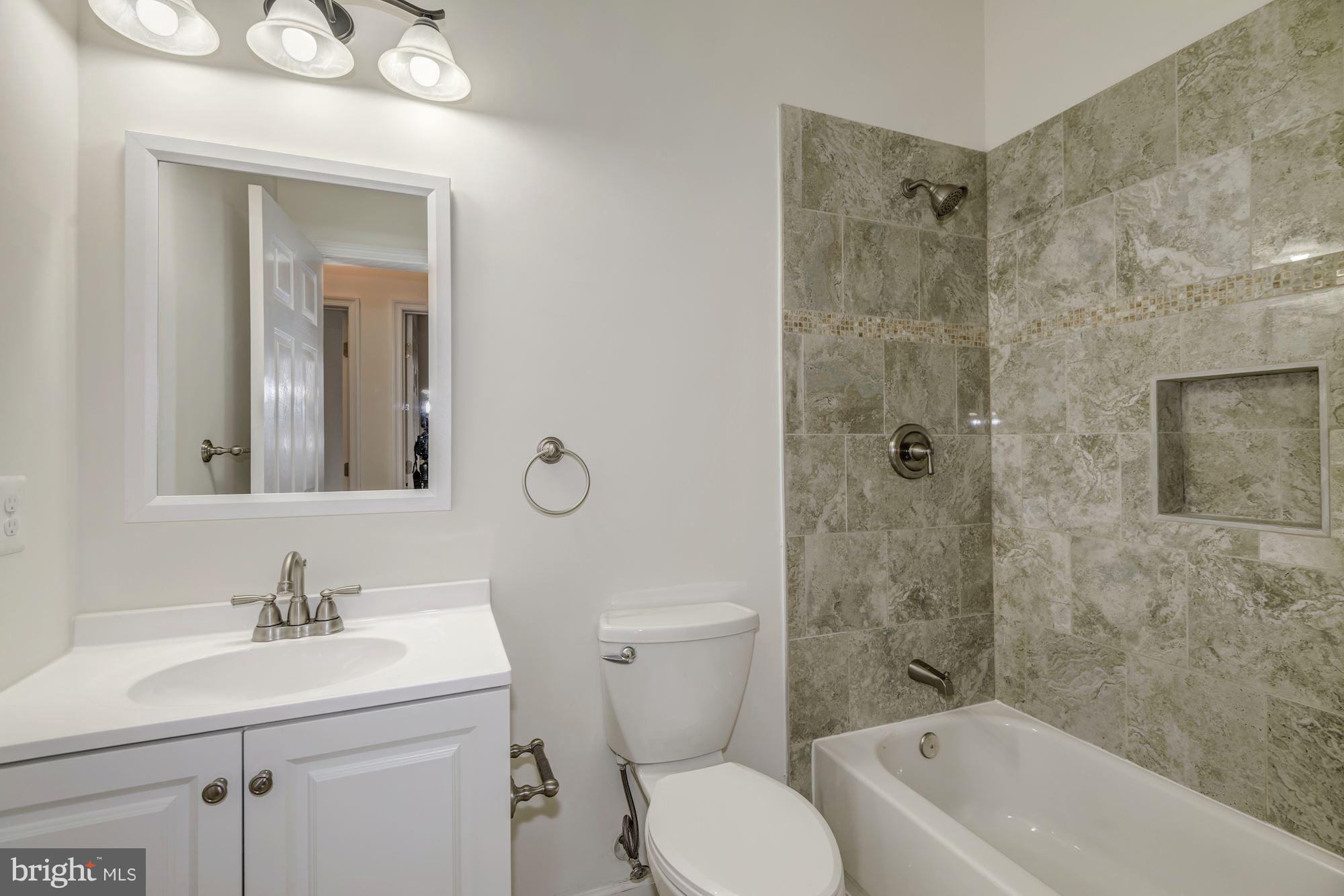 2016 South Glebe Road Arlington, VA 22204 - Photo 14 of 27 a bathroom with a sink toilet and shower