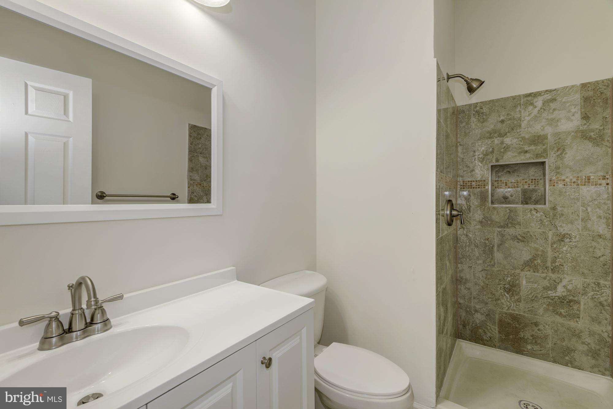 2016 South Glebe Road Arlington, VA 22204 - Photo 22 of 27 a bathroom with a sink toilet and shower
