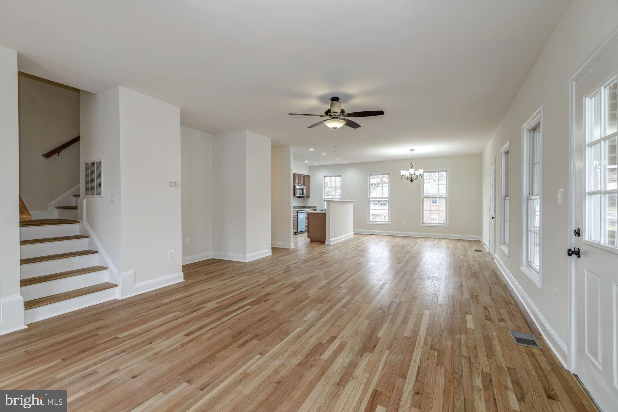 2016 South Glebe Road Arlington, VA 22204 - Photo 5 of 27 a view of an empty room with wooden floor and a window