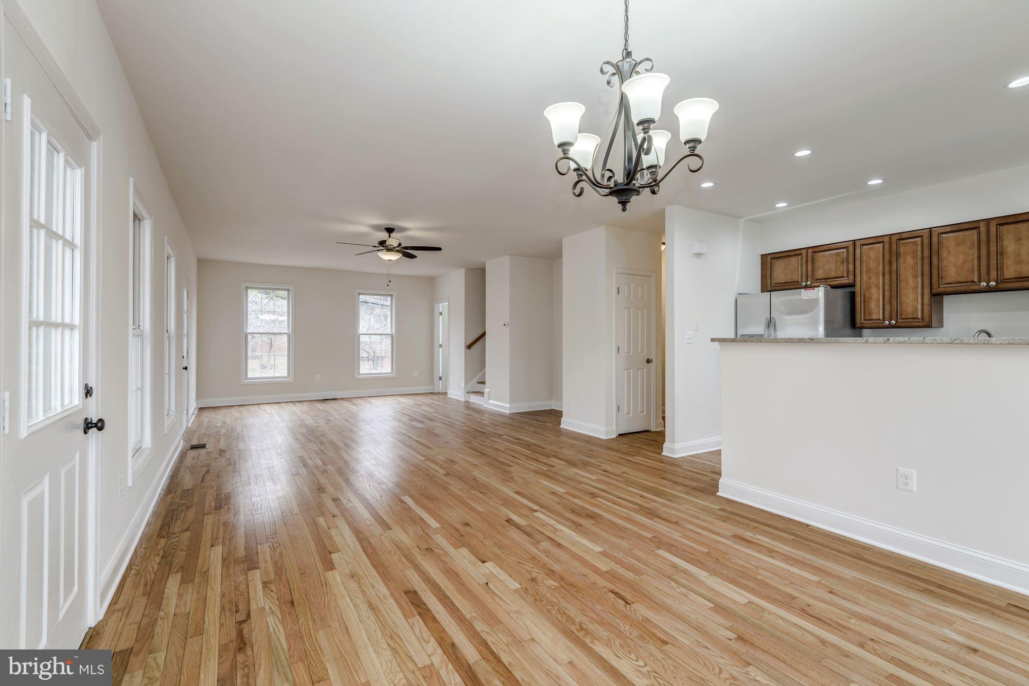 2016 South Glebe Road Arlington, VA 22204 - Photo 8 of 27 a view of a room with wooden floor and chandelier