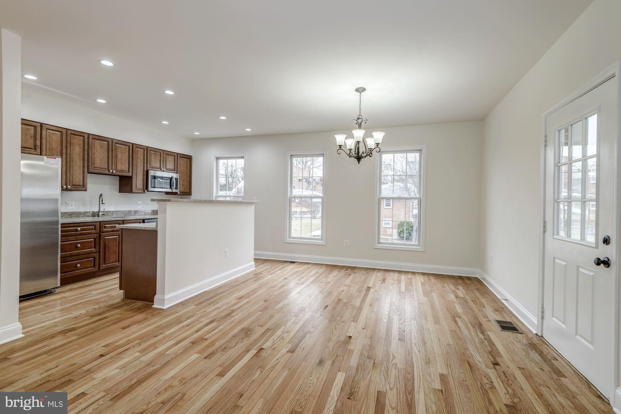 2016 South Glebe Road Arlington, VA 22204 - Photo 9 of 27 a view of kitchen with granite countertop wooden floor stainless steel appliances and window