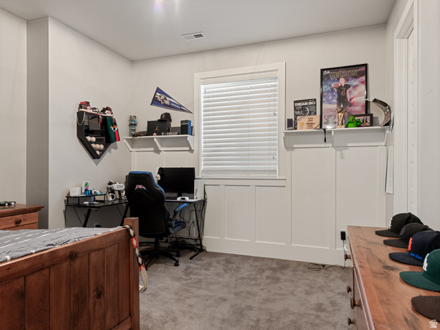 641 West 500 South Midway, UT 84049 - Photo 41 of 52 Carpeted room featuring a single window with blinds, white board and batten paneling, built-in shelving, and light gray painted walls