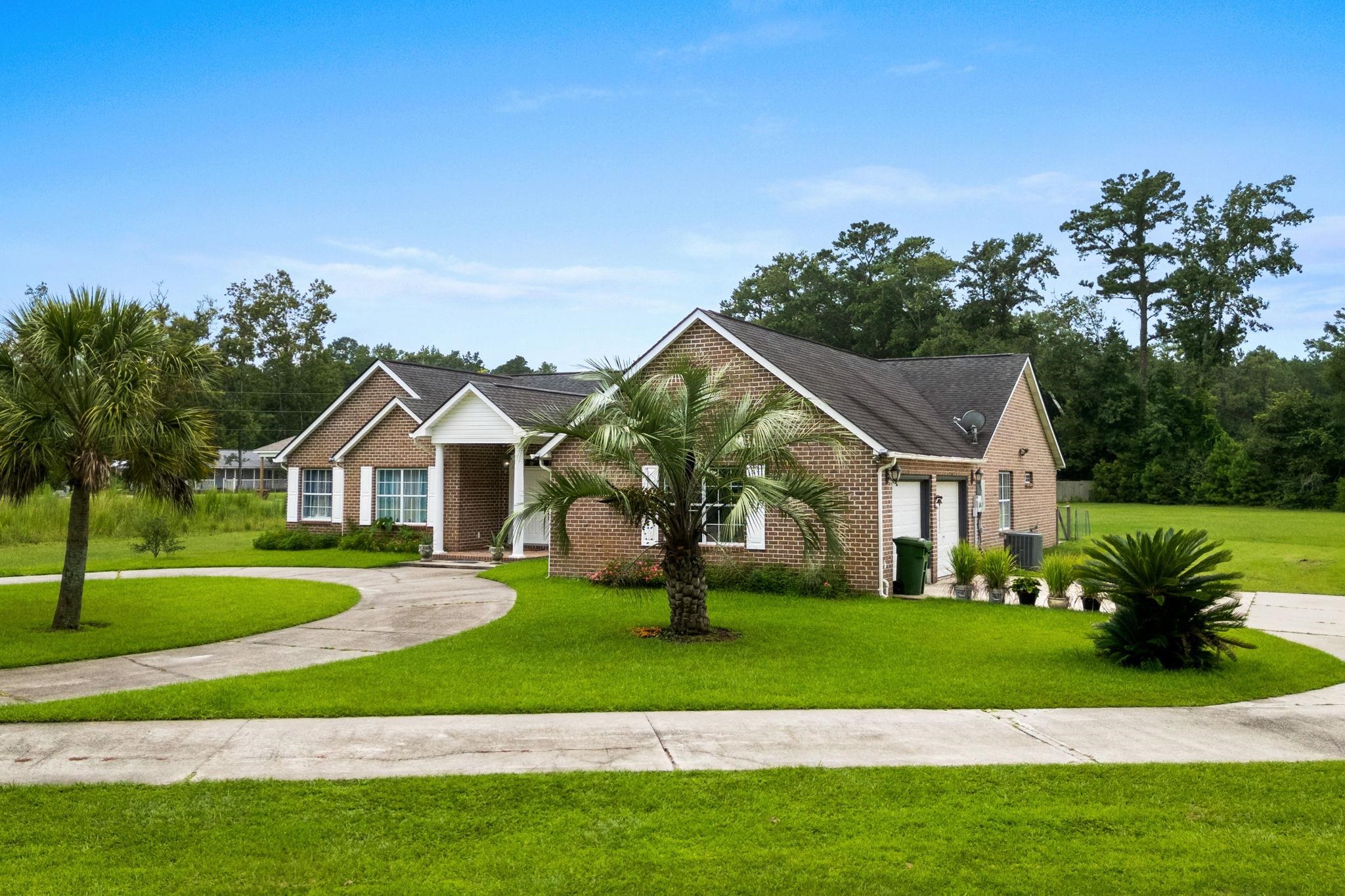 2981 Victor Road Longs, SC 29568 - Photo 2 of 32 View of front facade featuring a front lawn and brick siding