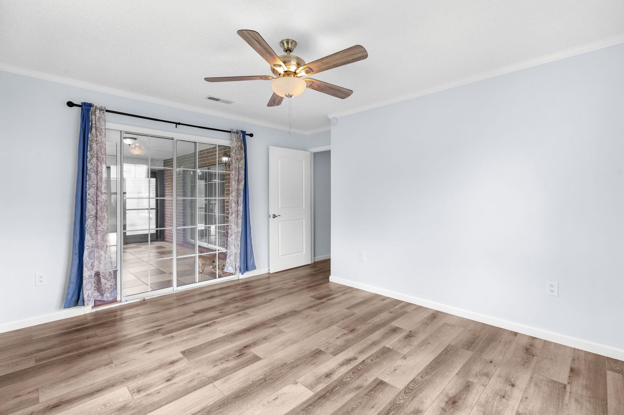 2981 Victor Road Longs, SC 29568 - Photo 27 of 32 Spare room with ornamental molding, wood finished floors, and ceiling fan
