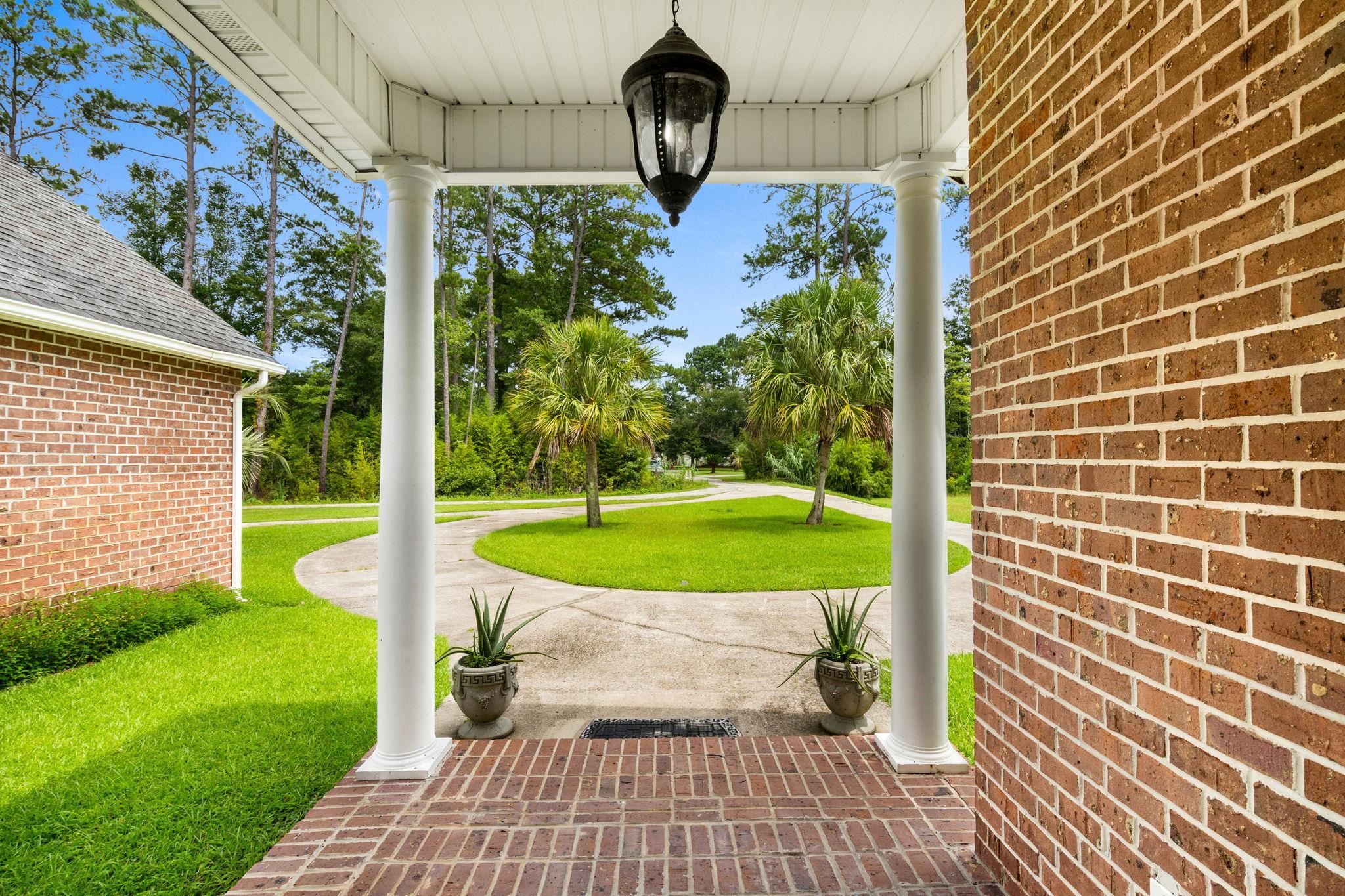 2981 Victor Road Longs, SC 29568 - Photo 4 of 32 Covered porch featuring a lawn