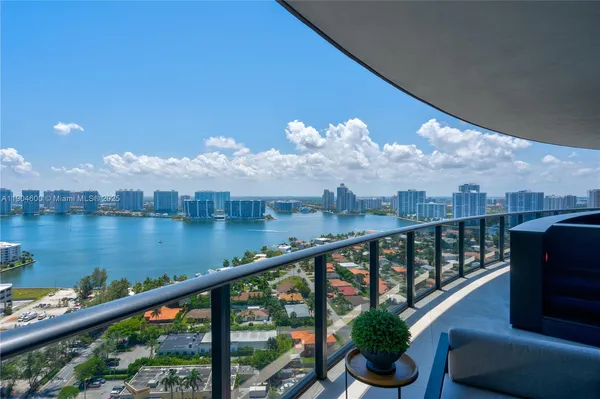 a view of a balcony with wooden floor