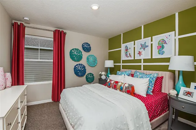 a bed room with a bed and a couch