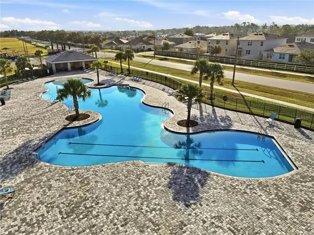 a view of a swimming pool with a lake view and mountain view