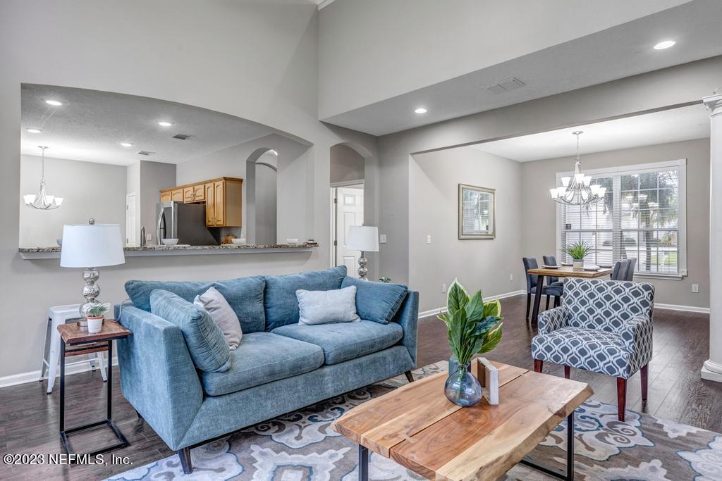 428 Sparrow Branch Circle St. Johns, FL 32259 - Photo 13 of 42 a living room with furniture and wooden floor