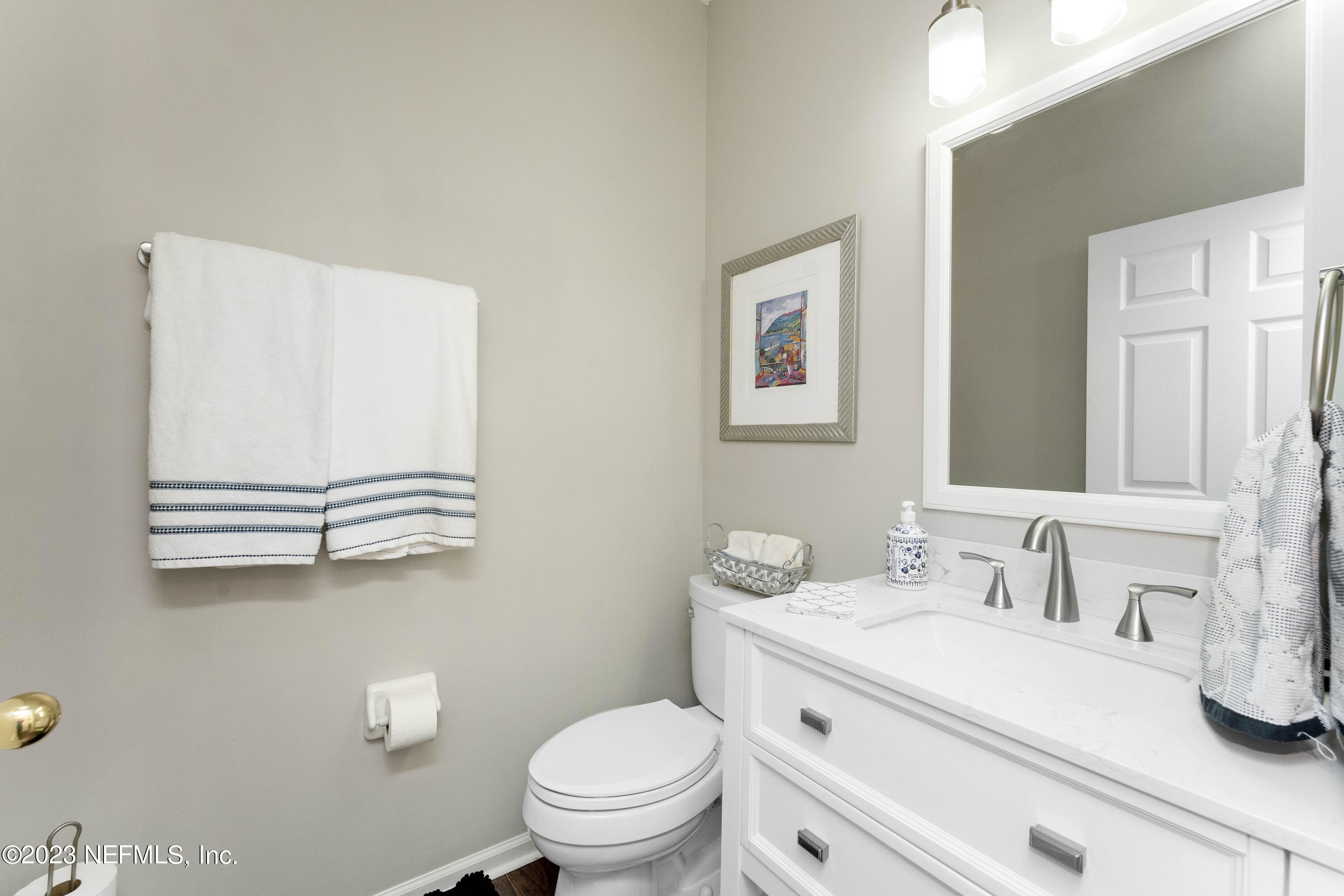 428 Sparrow Branch Circle St. Johns, FL 32259 - Photo 20 of 42 a bathroom with a sink a toilet and mirror