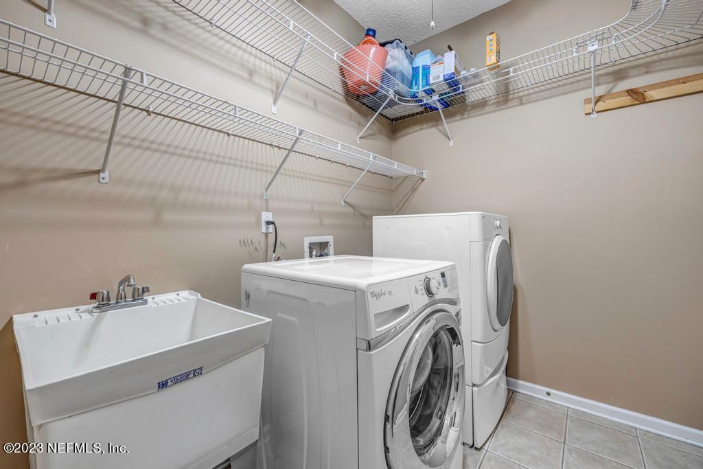 428 Sparrow Branch Circle St. Johns, FL 32259 - Photo 21 of 42 a utility room with dryer and washer