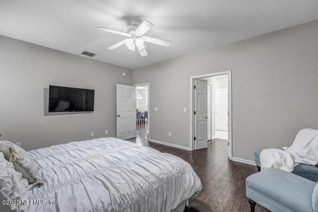 428 Sparrow Branch Circle St. Johns, FL 32259 - Photo 24 of 42 a bedroom with a bed and a television