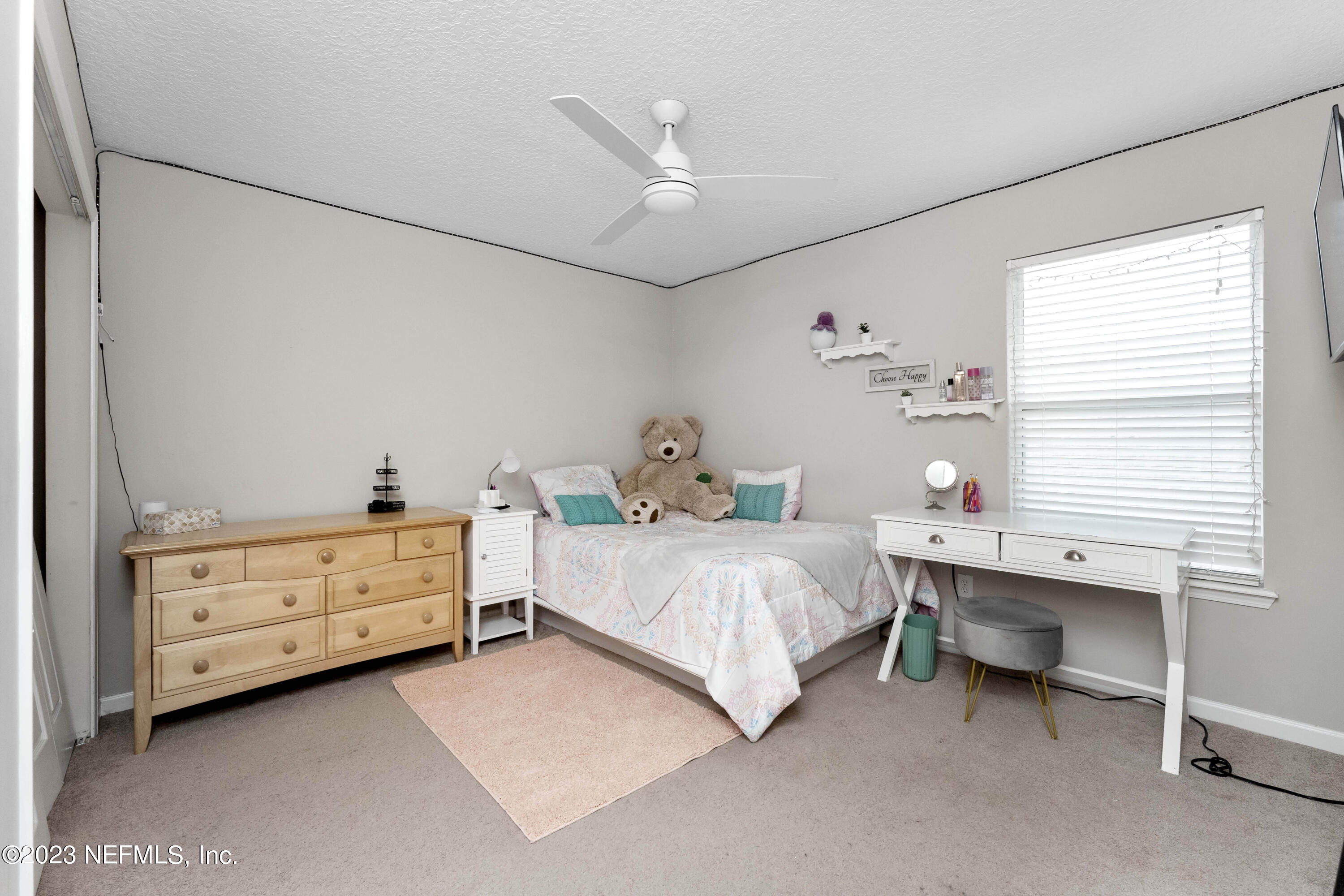 428 Sparrow Branch Circle St. Johns, FL 32259 - Photo 32 of 42 a bedroom with a bed and a window