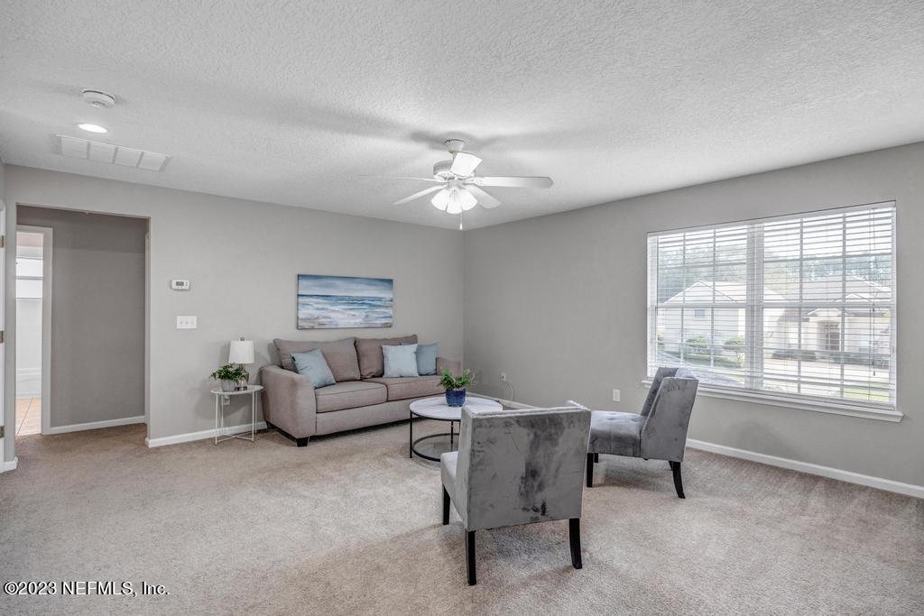 428 Sparrow Branch Circle St. Johns, FL 32259 - Photo 35 of 42 a living room with furniture and a window