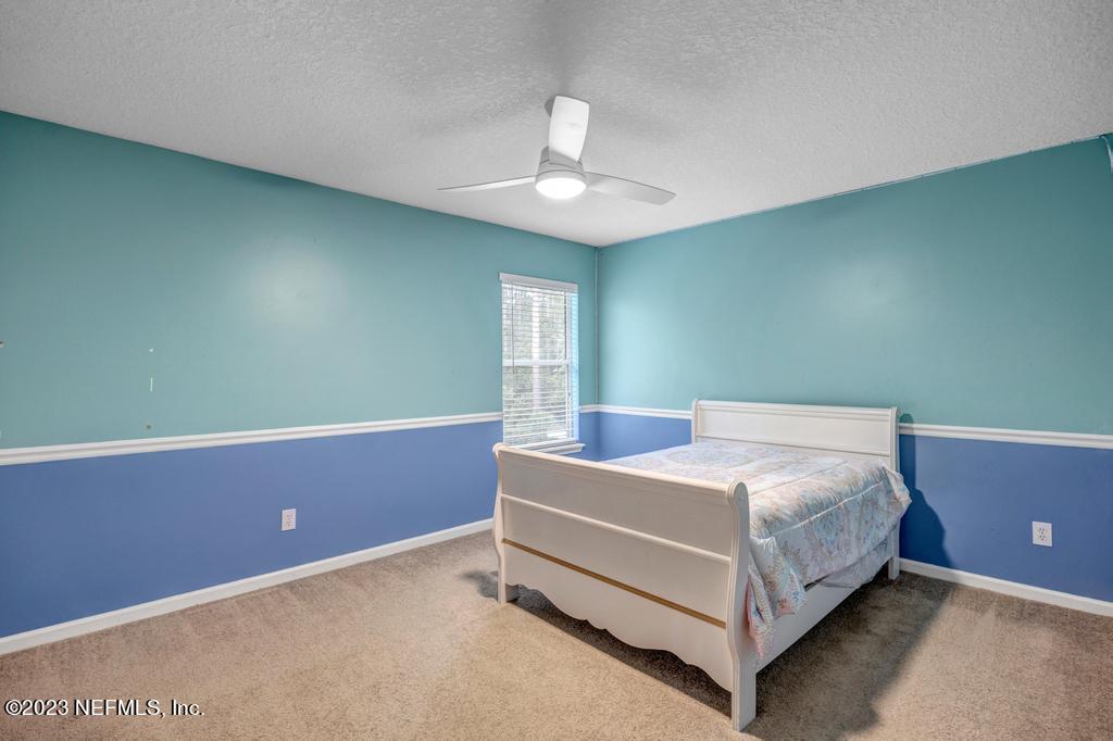 428 Sparrow Branch Circle St. Johns, FL 32259 - Photo 36 of 42 a bed room with a bed and a window