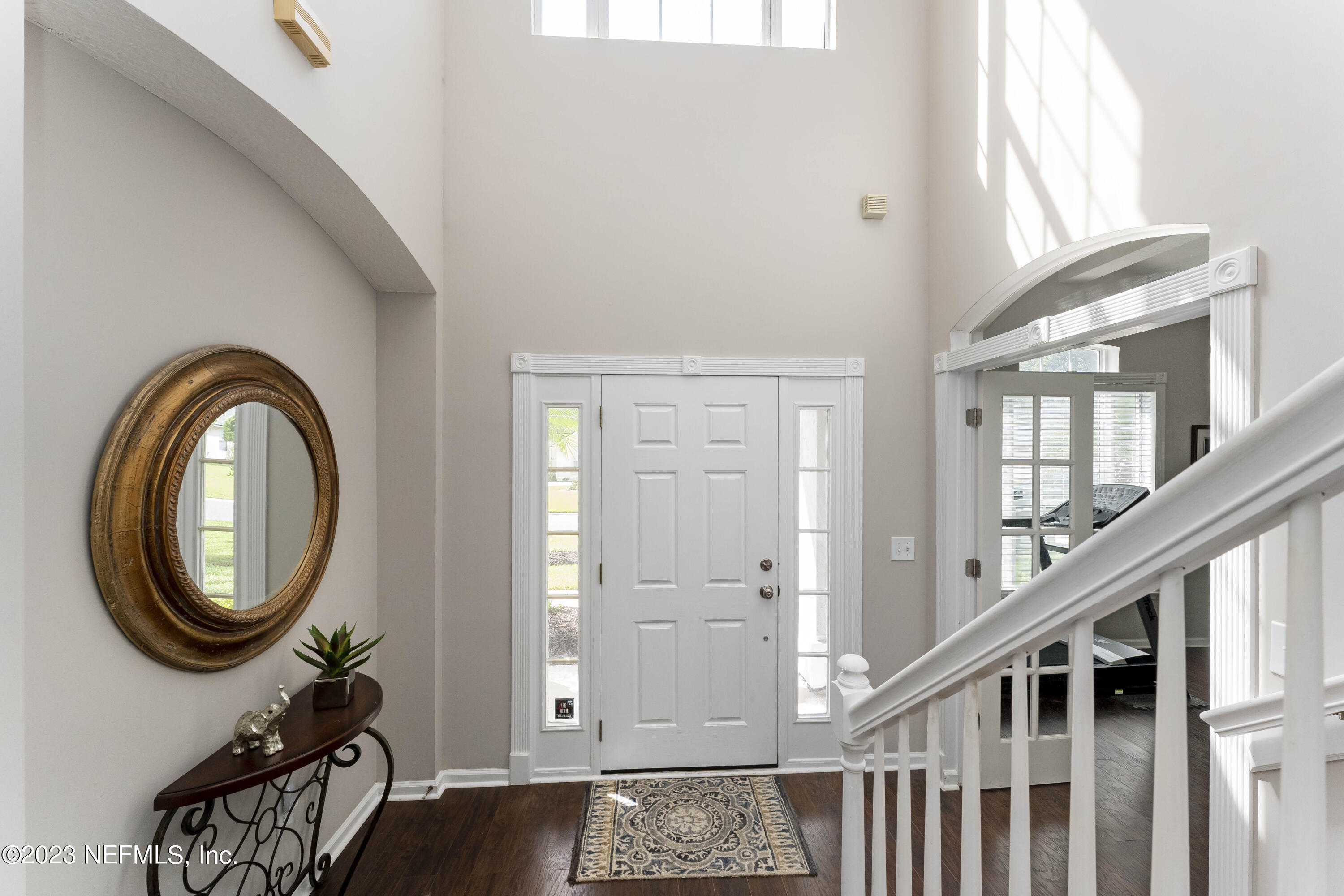 428 Sparrow Branch Circle St. Johns, FL 32259 - Photo 4 of 42 a view of a hallway with entryway wooden floor and front door
