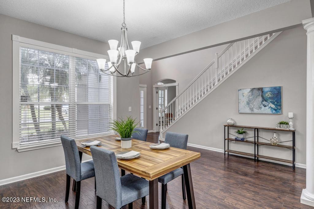 428 Sparrow Branch Circle St. Johns, FL 32259 - Photo 7 of 42 a view of a dining room with furniture window and wooden floor