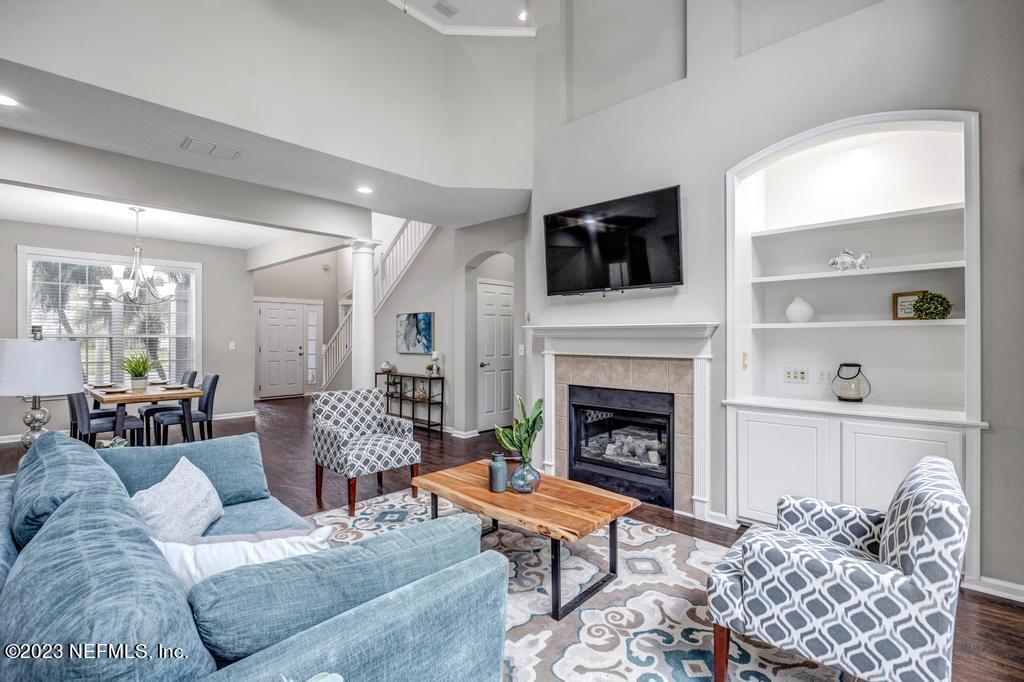 428 Sparrow Branch Circle St. Johns, FL 32259 - Photo 9 of 42 a living room with furniture and a fireplace