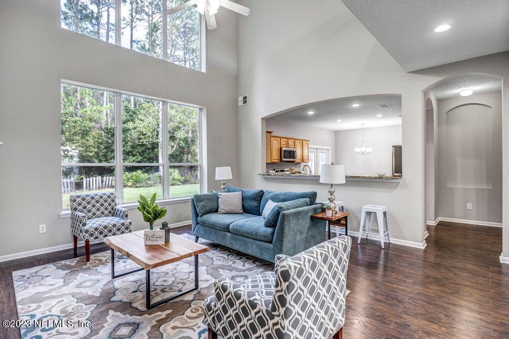 428 Sparrow Branch Circle St. Johns, FL 32259 - Photo 10 of 42 a living room with furniture and a large window