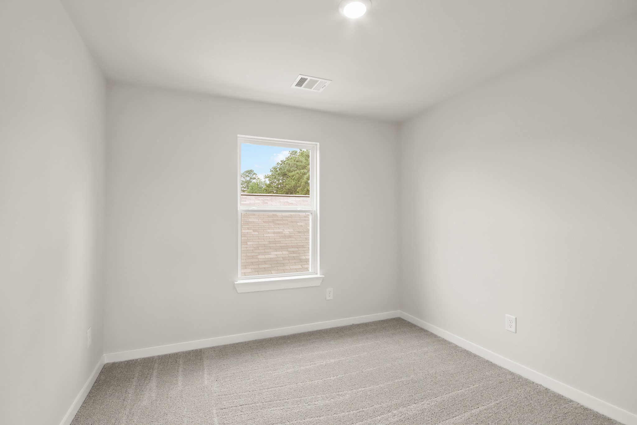 229 Spring Drive Hockley, TX 77447 - Photo 18 of 26 an empty room with a window