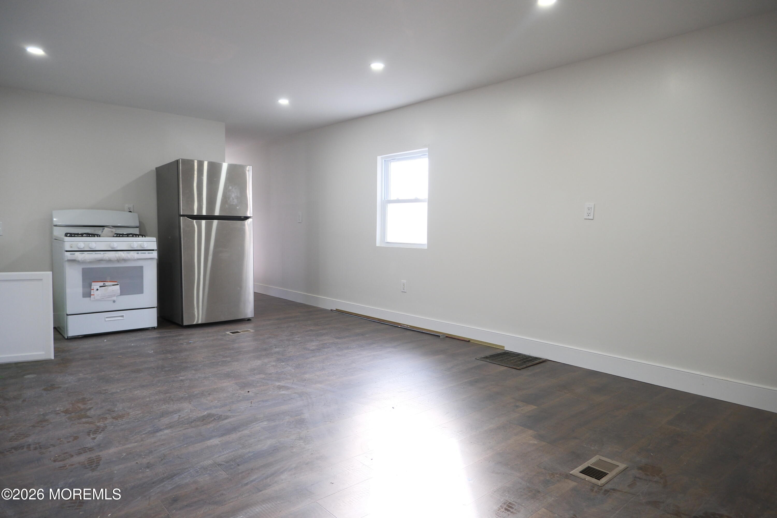 335 Adams Street Eatontown, NJ 07724 - Photo 2 of 7 an empty room with windows