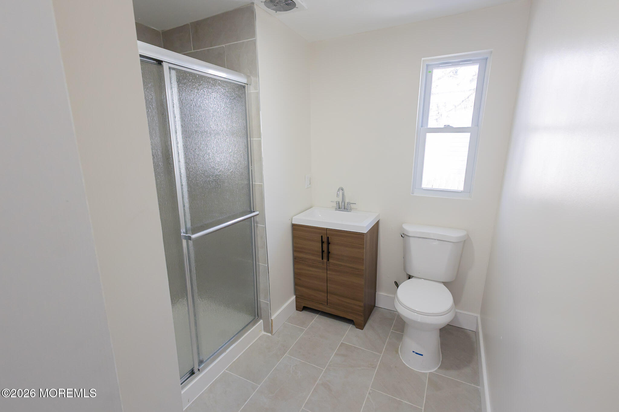 335 Adams Street Eatontown, NJ 07724 - Photo 6 of 10 a bathroom with a toilet sink and shower