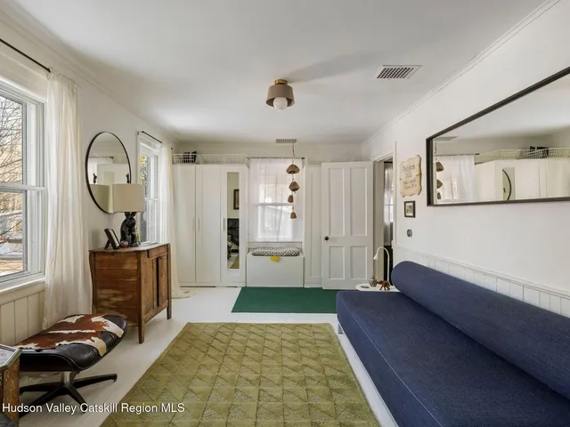 a bed room with a bed and a dresser