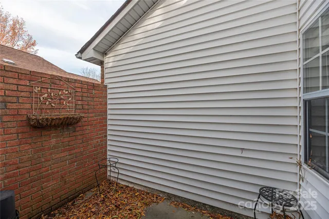 a view of a door and a brick wall