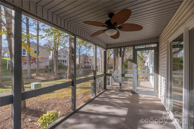 a view of a porch with a table and chairs