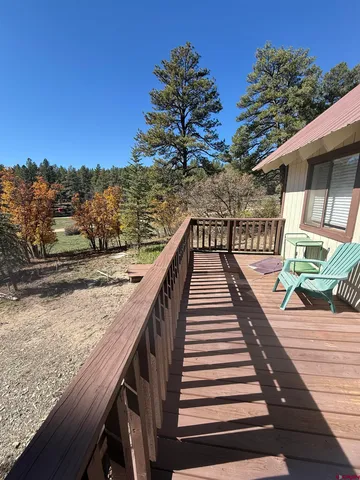 a living room with furniture window and wooden floor